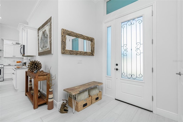 entrance foyer featuring crown molding