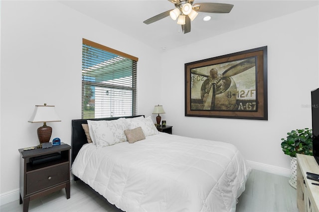 bedroom featuring light wood-type flooring and ceiling fan