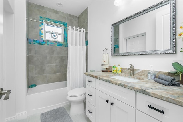 full bathroom featuring tile patterned floors, shower / tub combo with curtain, vanity, and toilet