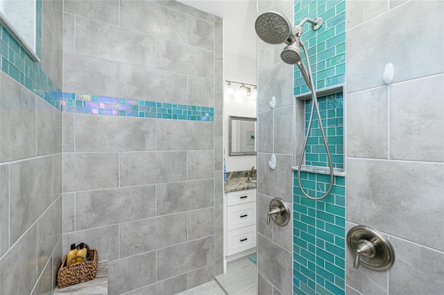 bathroom with tiled shower