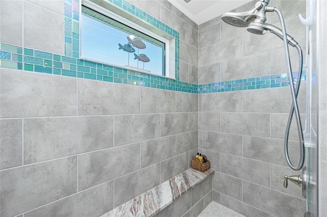 bathroom with a tile shower