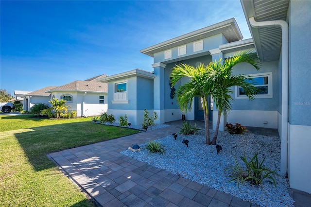 contemporary house featuring a front yard