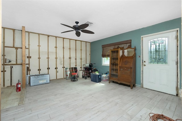 miscellaneous room with light wood-type flooring and ceiling fan