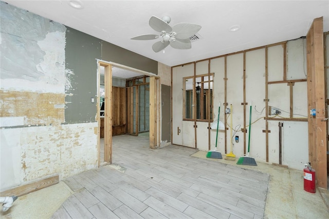 unfurnished room with light hardwood / wood-style flooring and ceiling fan