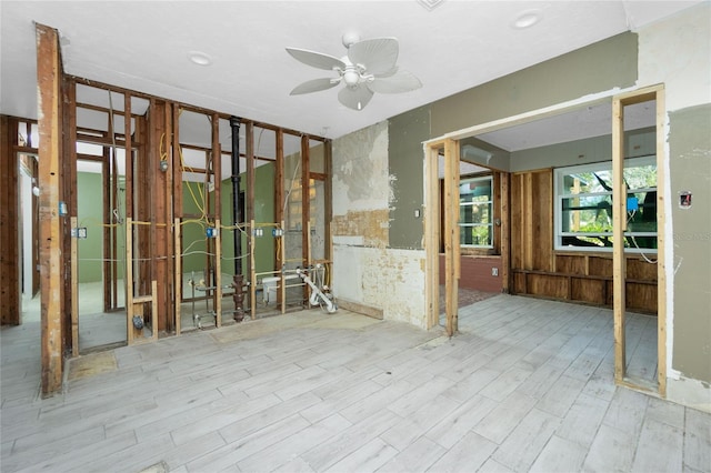 interior space with ceiling fan and light wood-type flooring