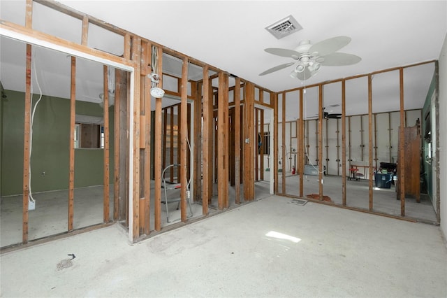 interior space with ceiling fan