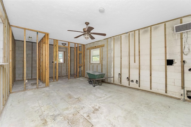 basement with ceiling fan