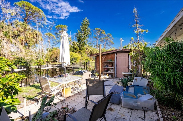 view of patio with a storage shed