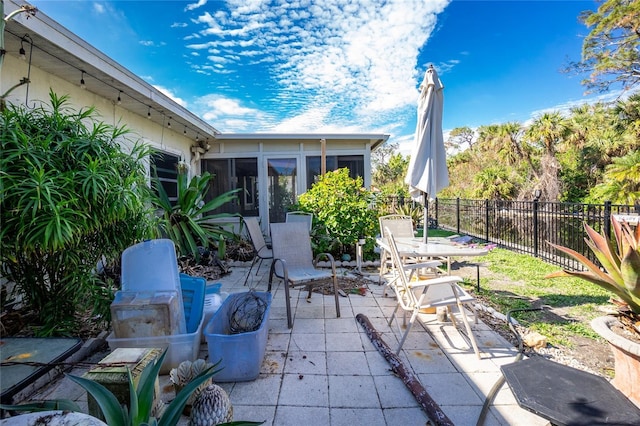 view of patio / terrace with a sunroom