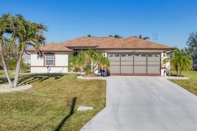 single story home with a garage and a front lawn