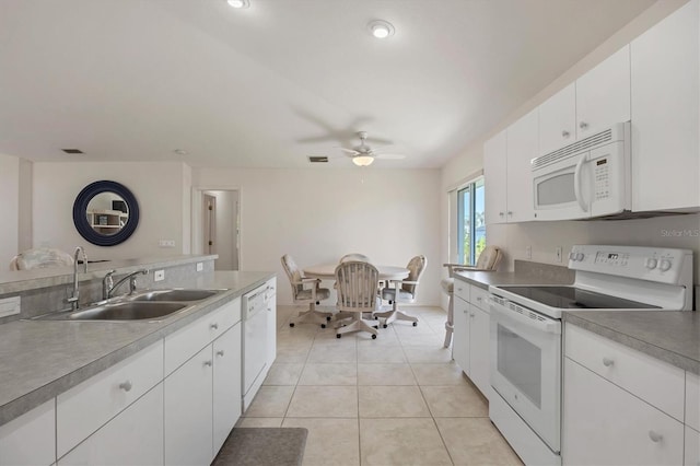 kitchen with white cabinetry, sink, ceiling fan, white appliances, and light tile patterned flooring