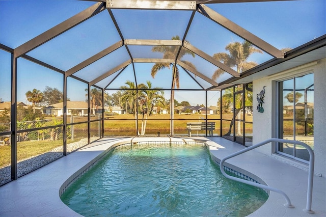 view of pool with a lanai and a patio area