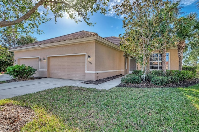 view of front facade with a garage and a front yard