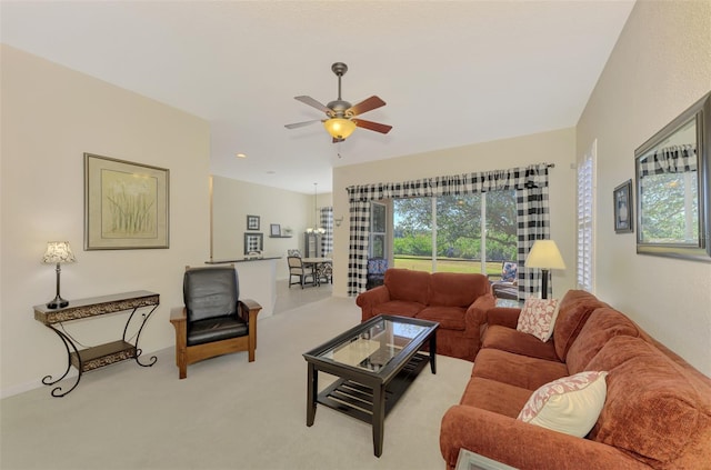 living room with light carpet and ceiling fan