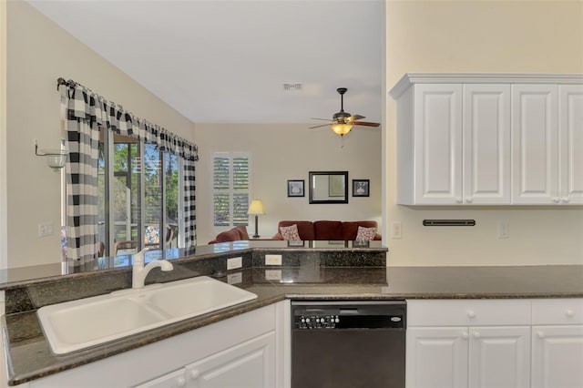 kitchen featuring black dishwasher, sink, white cabinets, and kitchen peninsula