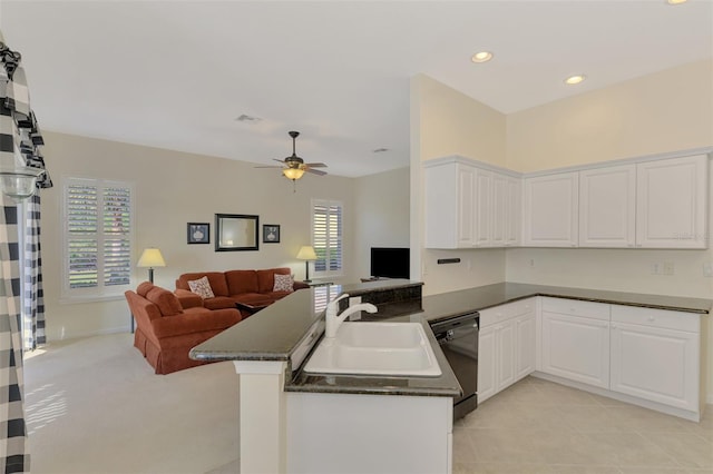 kitchen featuring kitchen peninsula, sink, dishwasher, and white cabinets