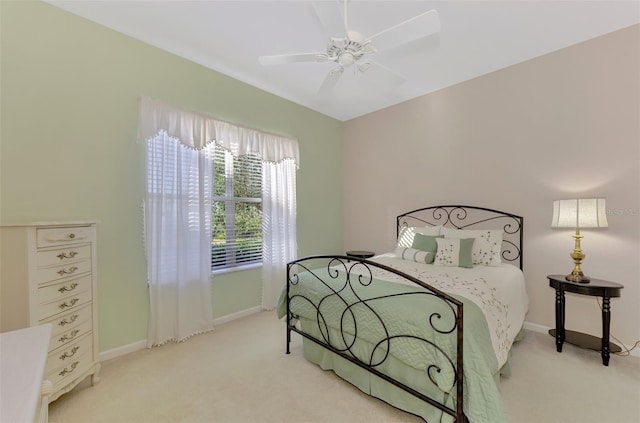 bedroom with ceiling fan and light colored carpet