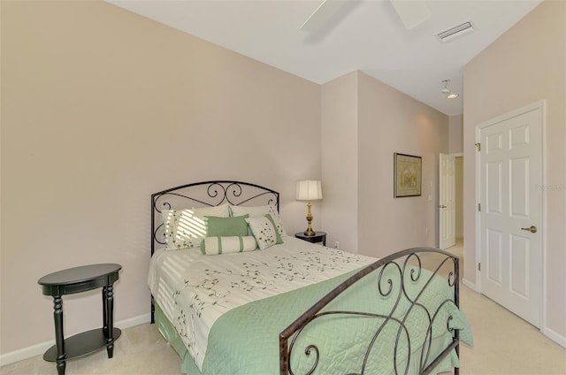 bedroom featuring light carpet and ceiling fan