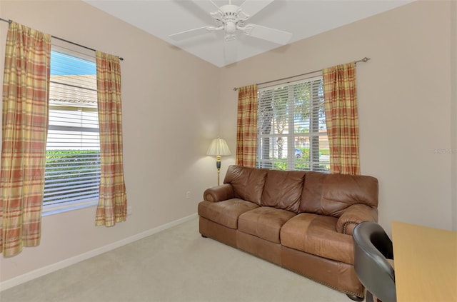 living room featuring carpet flooring and ceiling fan