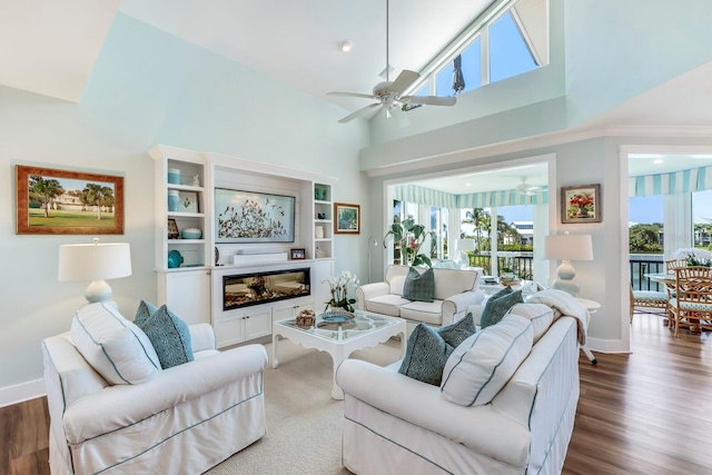 living room with ceiling fan, high vaulted ceiling, and dark hardwood / wood-style floors