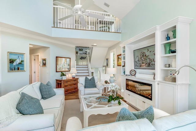 living room featuring ceiling fan, light colored carpet, and high vaulted ceiling