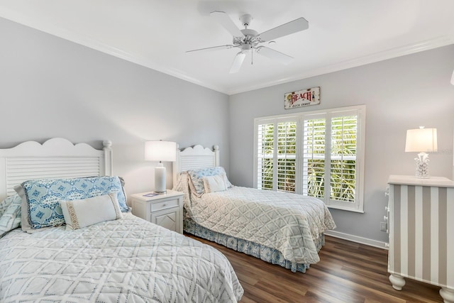 bedroom with dark hardwood / wood-style flooring, ceiling fan, and crown molding