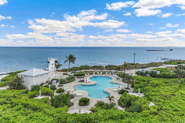 birds eye view of property with a water view