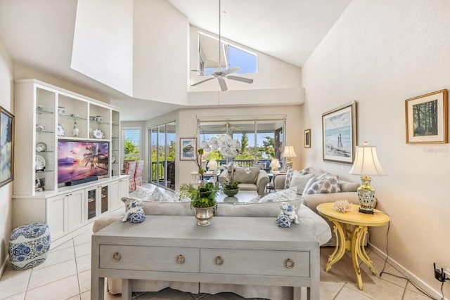 tiled living room featuring high vaulted ceiling and ceiling fan