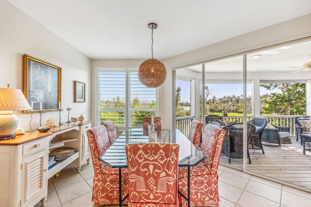 dining area with ceiling fan and light tile patterned flooring