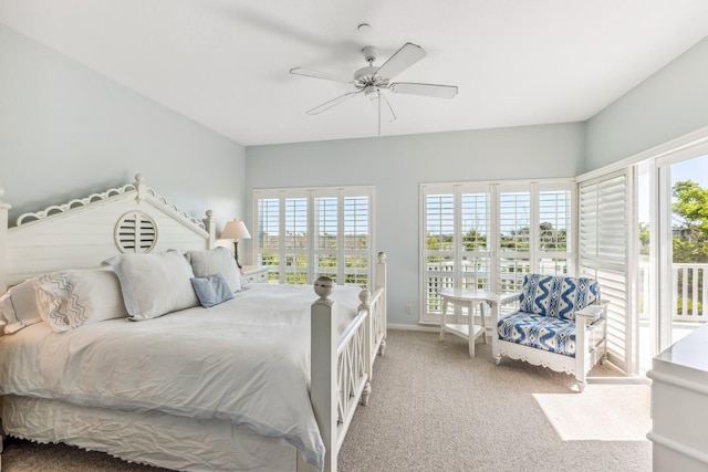 carpeted bedroom featuring access to exterior and ceiling fan