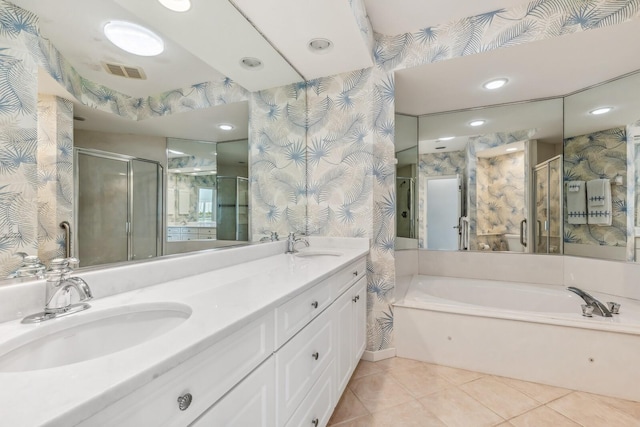 bathroom with tile patterned floors, vanity, and separate shower and tub