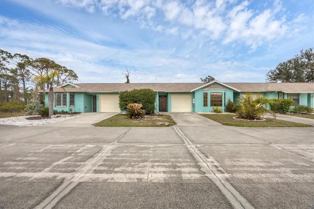 ranch-style house featuring a garage