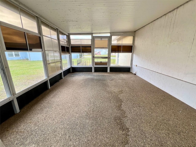 unfurnished sunroom with plenty of natural light