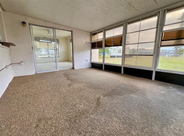 unfurnished sunroom featuring a wealth of natural light