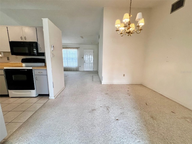 kitchen with a chandelier, electric range, pendant lighting, and light carpet