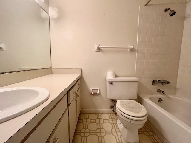 full bathroom with vanity, tiled shower / bath combo, and toilet