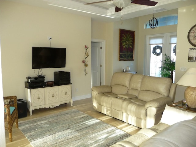 living room featuring ceiling fan and wood-type flooring