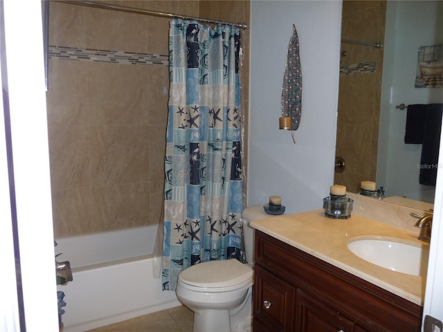 full bathroom featuring tile patterned floors, vanity, toilet, and shower / bath combo with shower curtain