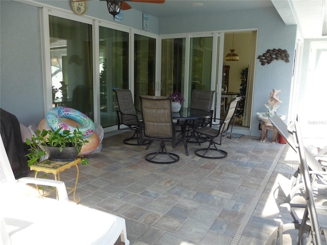 view of patio / terrace featuring ceiling fan