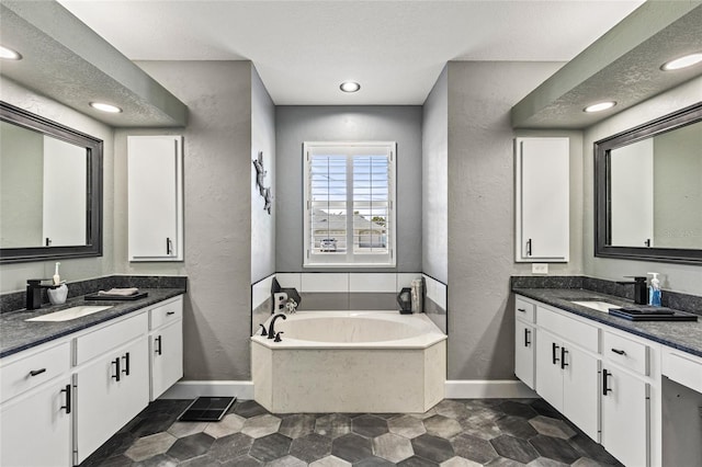 bathroom featuring a bath and vanity