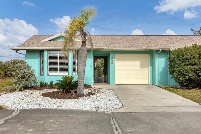 single story home featuring a garage