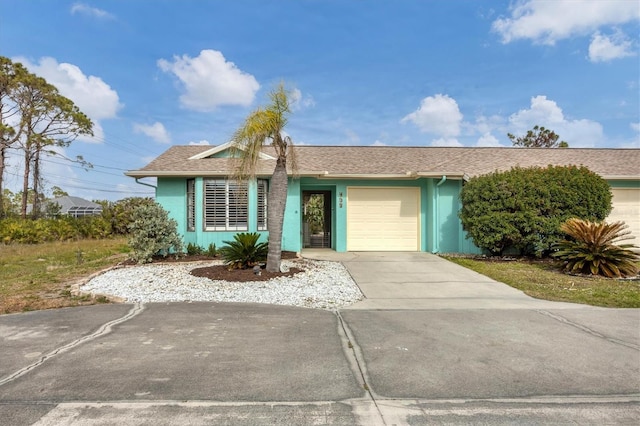 single story home with a garage