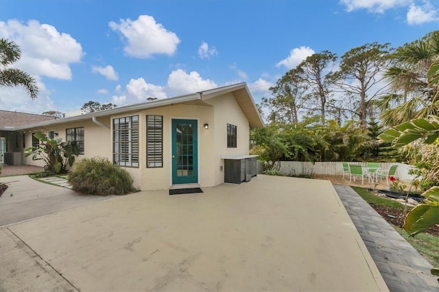 rear view of property featuring a patio