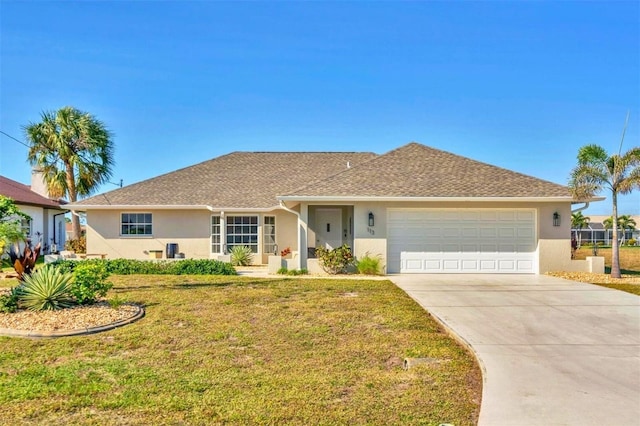 ranch-style home with a garage and a front yard