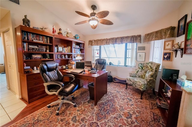 office area with ceiling fan, wood-type flooring, and lofted ceiling