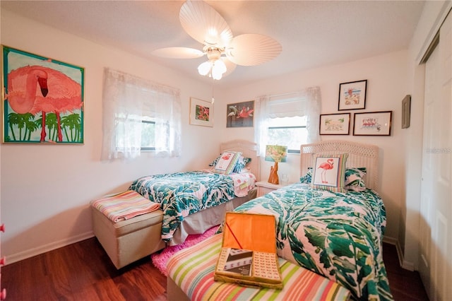 bedroom featuring dark hardwood / wood-style flooring and ceiling fan