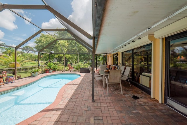 view of pool featuring a lanai and a patio area