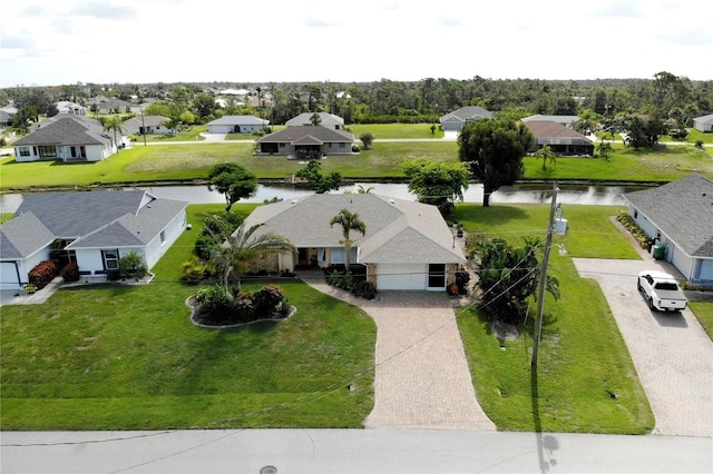 drone / aerial view with a water view