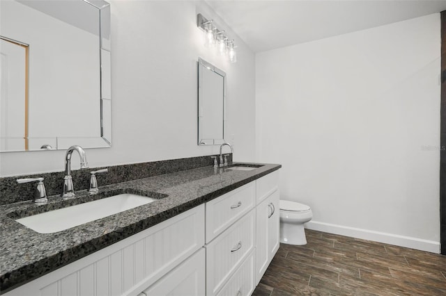 bathroom with toilet and vanity