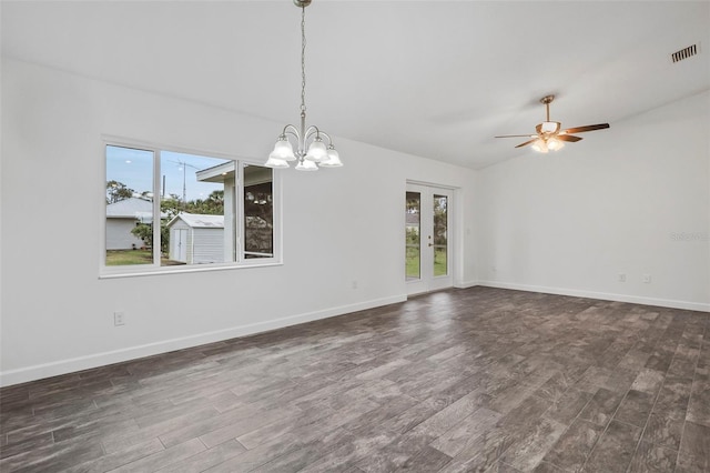 interior space with ceiling fan with notable chandelier and dark hardwood / wood-style floors